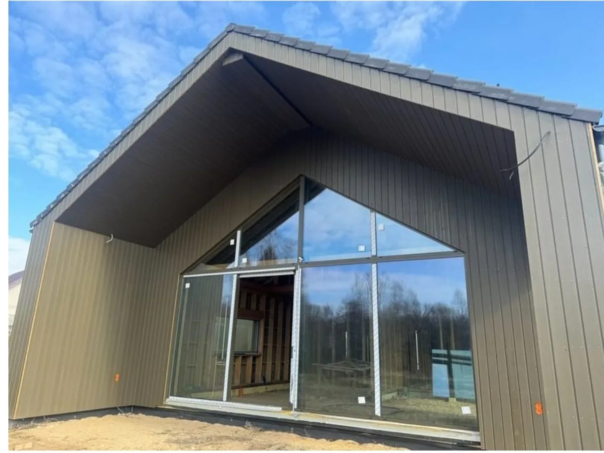 Anthracite PVC windows and glazing in a timber building supplied by IdeasWood